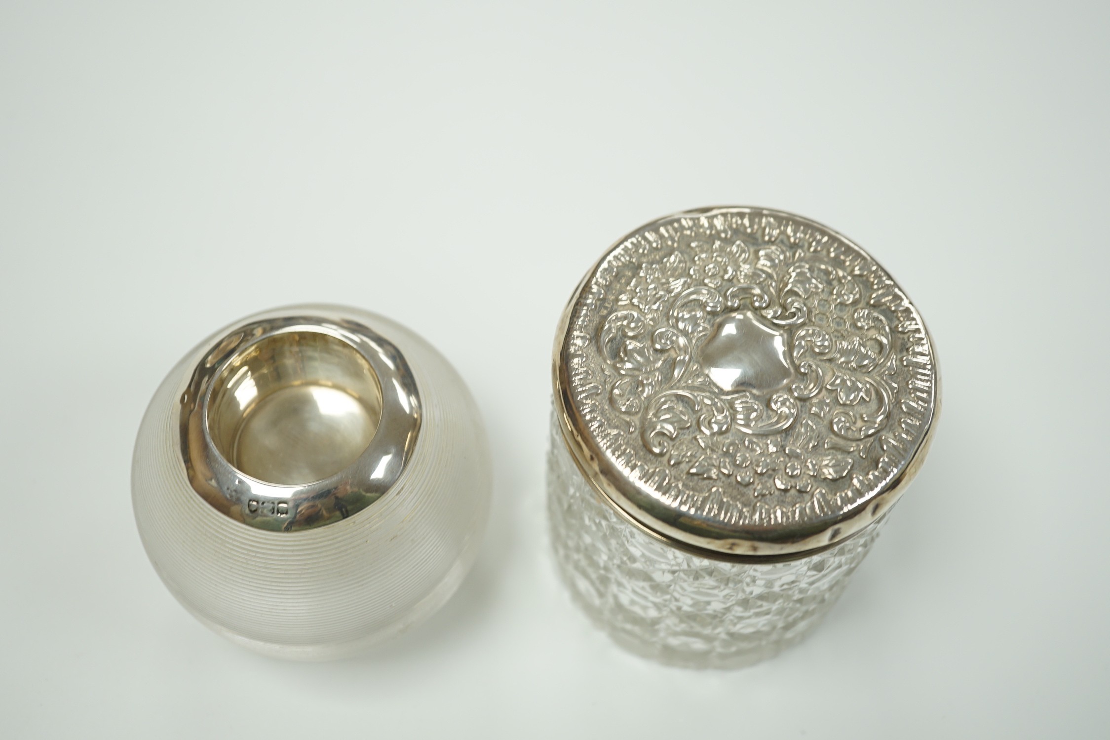An early 20th century silver mounted ribbed glass match tidy, marks rubbed, height 70mm and a toilet jar